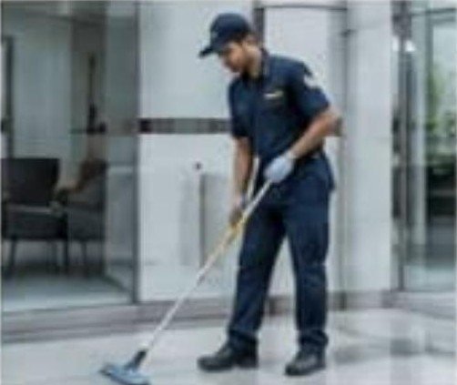 Housekeeping staff maintaining a clean corridor